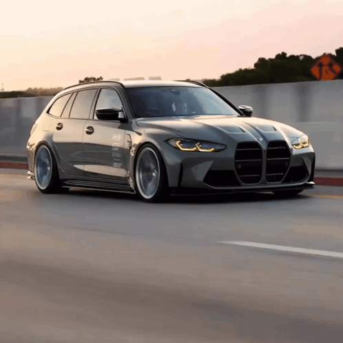 BMW Driving Down Highway With No Left Turns Sign