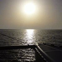 Boat Sailing During Sunset GIF