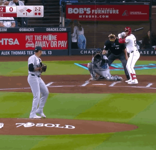 Bob's Furniture Ad Behind Baseball Player GIF