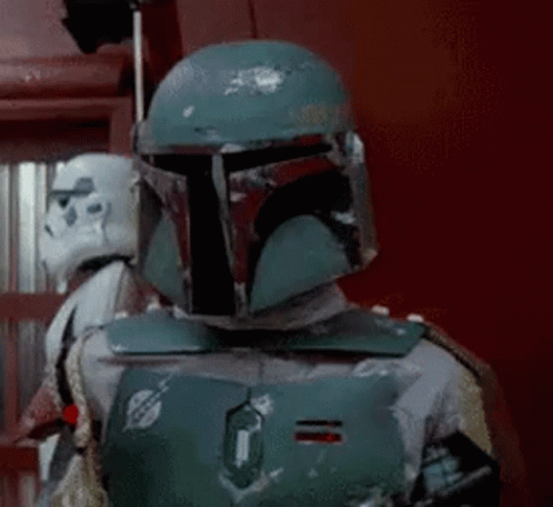 Boba Fett Is Wearing A Helmet And Standing Next To A Storm Trooper In A Room . GIF