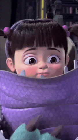 Boo From Monsters Inc Has A Purple Blanket Around Her Neck GIF