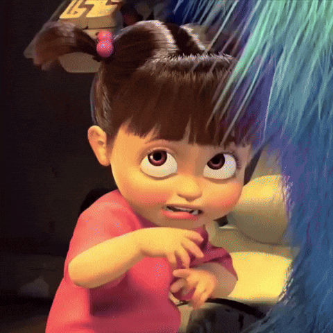 Boo From Monsters Inc Is A Little Girl With Big Eyes And A Pink Shirt GIF