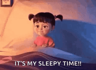 Boo From Monsters Inc Is Sitting In A Bed With The Words `` It 'S My Sleepy Time '' . GIF