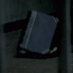 Book on Ground in Dark Room