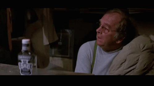 Bottle Of Jack Daniel's Next To Man GIF