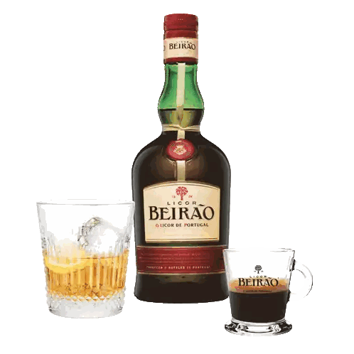 Bottle of Licor Beirão Next to Cup