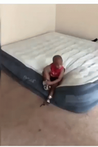 Bouncing Bed Fly Kid GIF