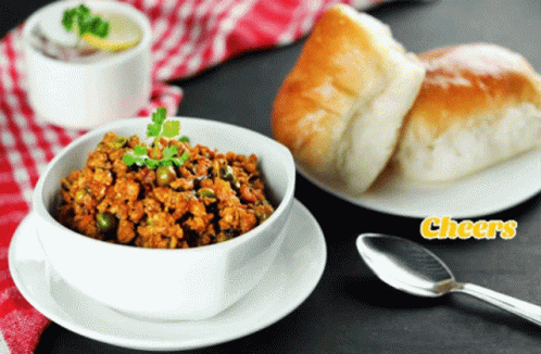 Bowl of Food and Plate of Bread Cheers