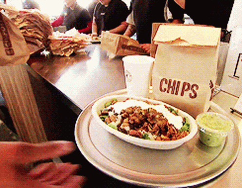 Bowl of Food Next to Chips Bag