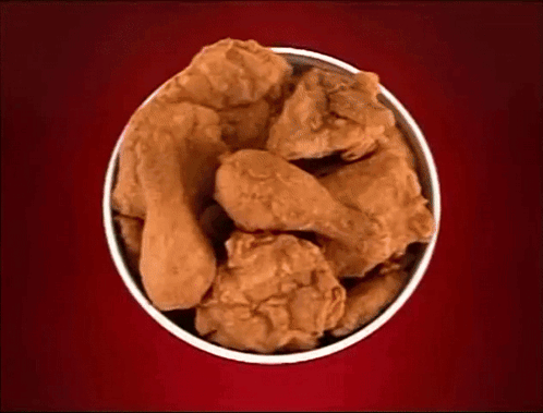 Bowl Of Fried Chicken On Red Surface GIF