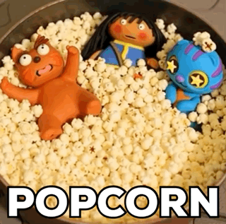 Bowl of Popcorn With Stuffed Animals Saying Popcorn