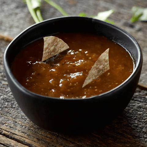 Bowl Of Salsa With Spinning Nachos GIF