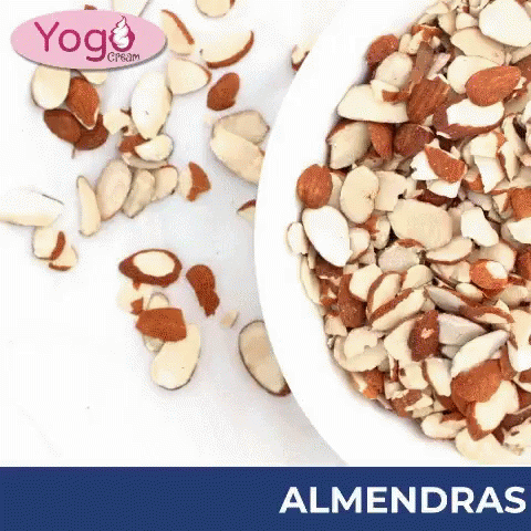 Bowl of Sliced Almonds Next to Whole Almonds Almendras