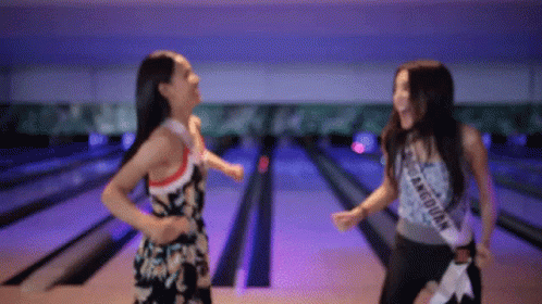 Two Woman Laughing Bowling Alley GIF