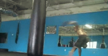Boxer Hitting Punching Bag In Front Of Mirror GIF