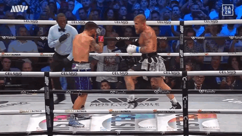 Boxers Fighting in Ring with Celsius Ads