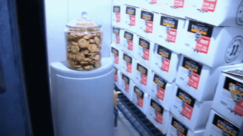 Boxes Of French Bread Are Stacked On Top Of Each Other In A Store GIF