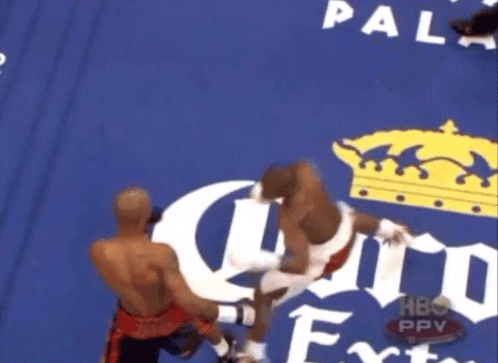 Boxing Match in Front of Corona Advertisement