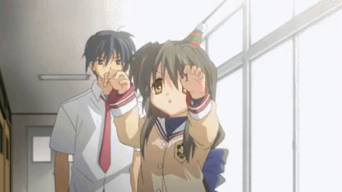 Boy And Girl In Hallway With Birthday Hat GIF