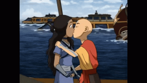 Boy and Girl Kissing in Front of Boat