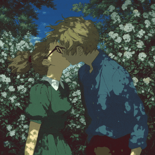 Boy And Girl Kissing In Front Of Flowers GIF