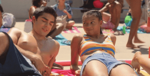 Boy and Girl Laying on Beach