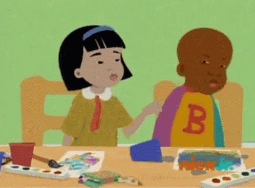 Boy And Girl Sitting At Table GIF
