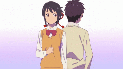 Boy and Girl Standing Back to Back