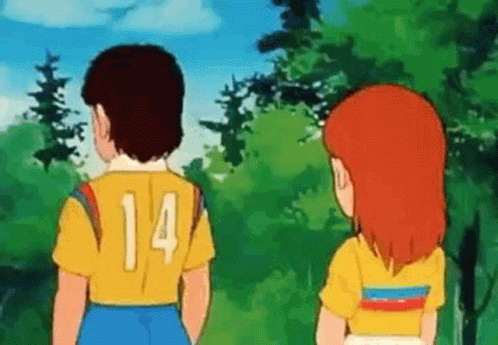 Boy and Girl Standing Together in Woods