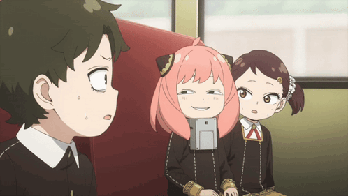 Boy and Girls Sitting on Red Couch