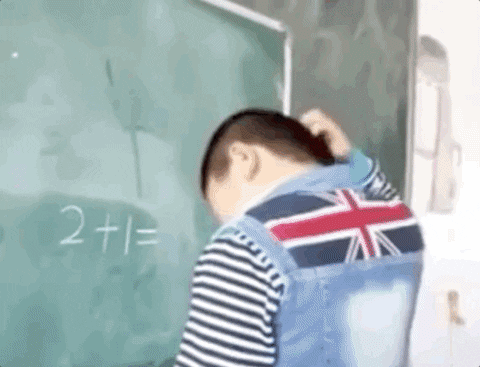 Boy Calculating And Confused While Facing The Board GIF