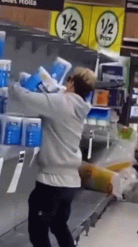 Boy Carries A Lot Of Toilet Paper GIF