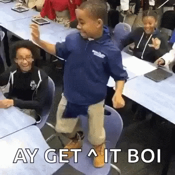 Boy Dancing in Classroom in Front of Students