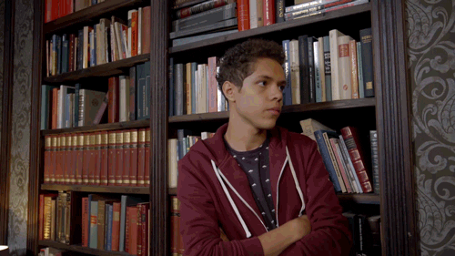 Boy Discovers Secret Door Opening GIF