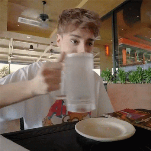Boy Drinking Water Slowly On Glass GIF