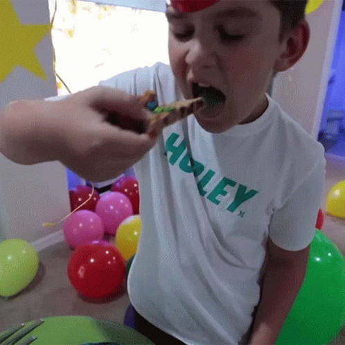 Boy Eating Cake On Birthday Party GIF