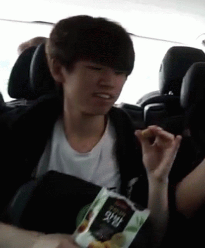 Boy Eating Chips in Car