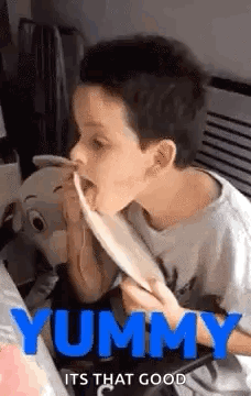 Boy Eating Spaghetti with Tongue Out