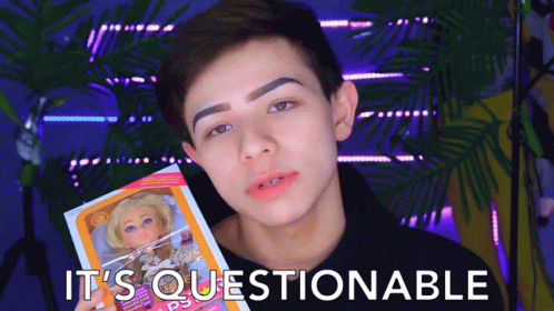 Boy Holding Doll Saying It's Questionable