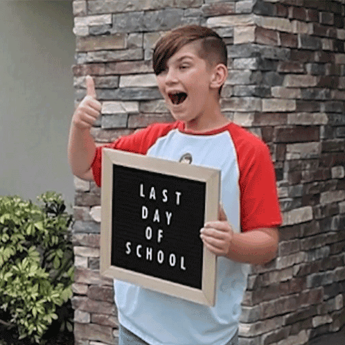 Boy Holding Last Day of School Sign