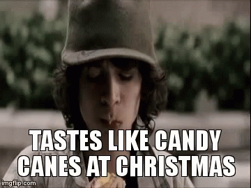 Boy in Baseball Cap Eating Candy Cane