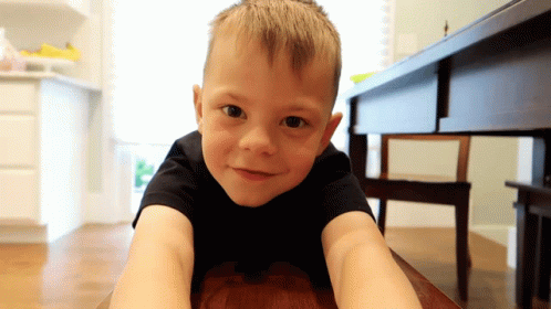 Boy in Black Shirt Lying Smiling