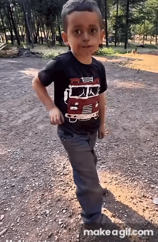 Boy in Black Shirt With Truck