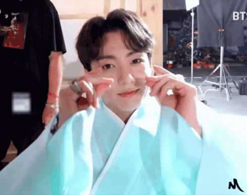 Boy in Blue Kimono Making Peace Sign