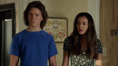 Boy in Blue Shirt and Girl in Black and White Dress