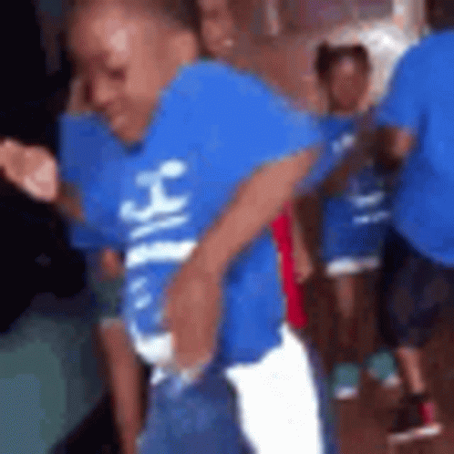 Boy In Blue Shirt Dancing With Group GIF
