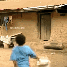 Boy in Blue Shirt Holding Bag