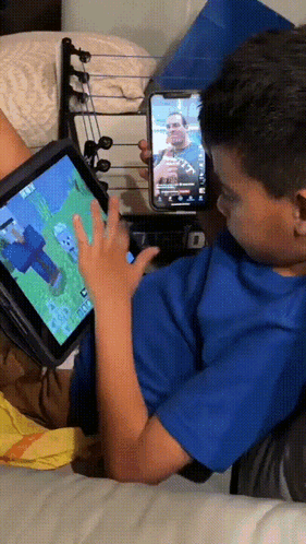 Boy In Blue Shirt Playing Tablet Game GIF