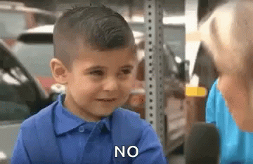 Boy in Blue Shirt Says No to Woman at Microphone