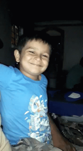 Boy in Blue Shirt Smiling